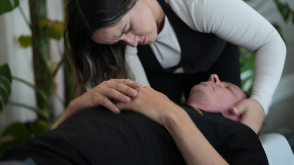 Chiropractic Care in Wilton Manors - Express Life Chiropractic | Chiropractor Fort Lauderdale. Woman performing chest compressions on a man lying down, providing first aid.